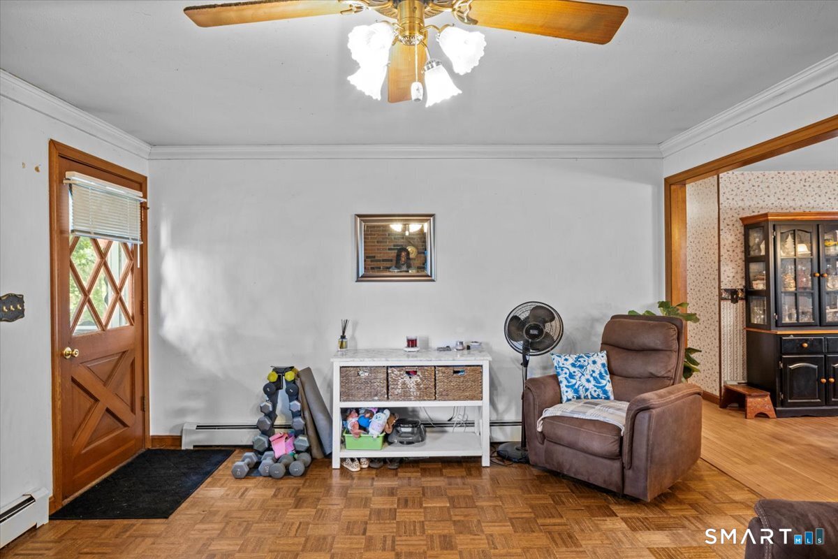 88 Pompeo Road Thompson, CT 06255 - Photo 22 of 40 a living room with furniture a flat screen tv and a window