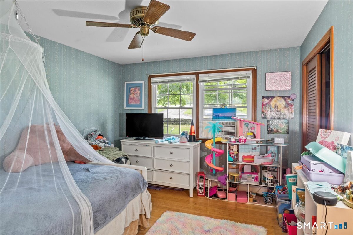 88 Pompeo Road Thompson, CT 06255 - Photo 23 of 40 a room with furniture and a flat screen tv