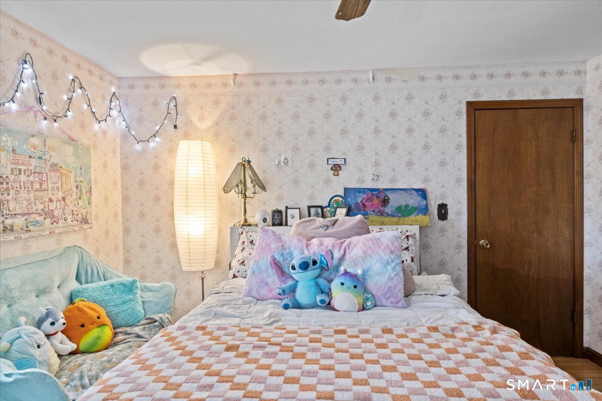 88 Pompeo Road Thompson, CT 06255 - Photo 25 of 40 a bedroom with a bed and a window