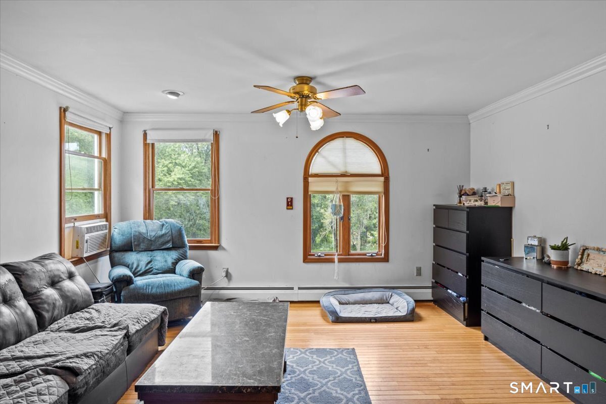 88 Pompeo Road Thompson, CT 06255 - Photo 33 of 40 a living room with furniture and a window