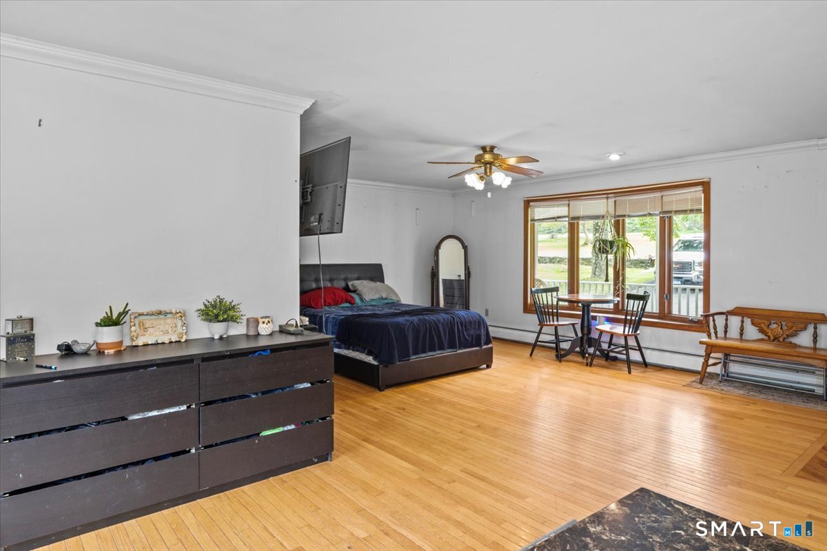 88 Pompeo Road Thompson, CT 06255 - Photo 35 of 40 a bedroom with furniture and a large window