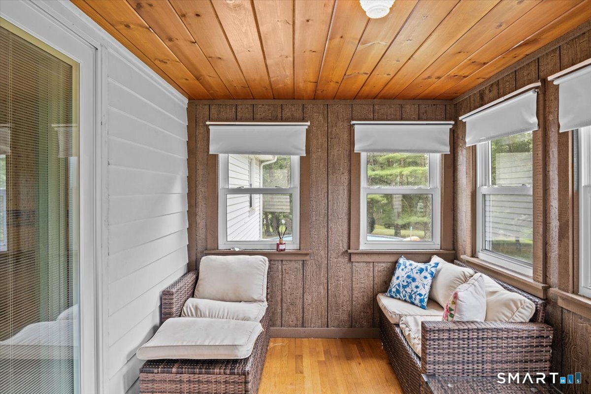 88 Pompeo Road Thompson, CT 06255 - Photo 39 of 40 a living room with furniture and a bathtub