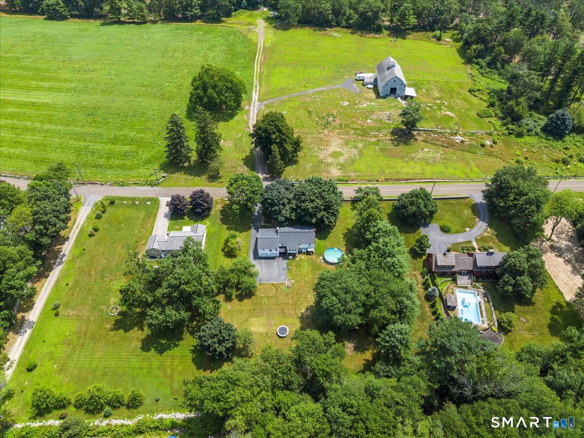 88 Pompeo Road Thompson, CT 06255 - Photo 7 of 40 an aerial view of ocean residential house with outdoor space and trees all around