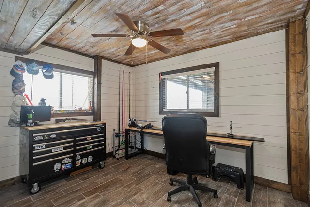 a bedroom with a bed and a refrigerator