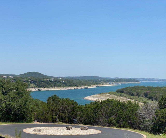 17803 Moon Rise Cove Jonestown, TX 78645 - Photo 11 of 20 a view of a lake with mountain in the background