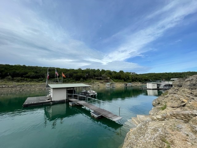 17803 Moon Rise Cove Jonestown, TX 78645 - Photo 2 of 20 a view of a lake with outdoor space