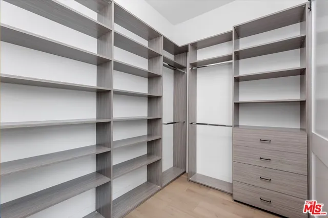 a bedroom with a bed and a table