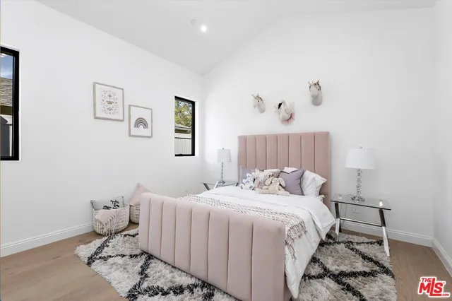 a bedroom with a bed and a view of bathroom
