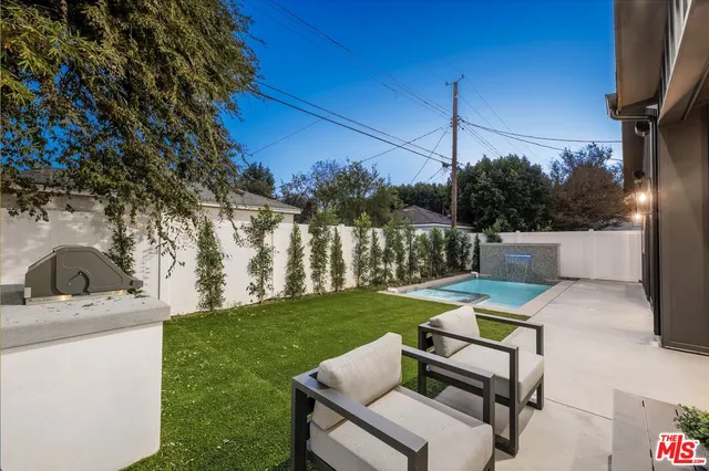 a view of swimming pool with a patio
