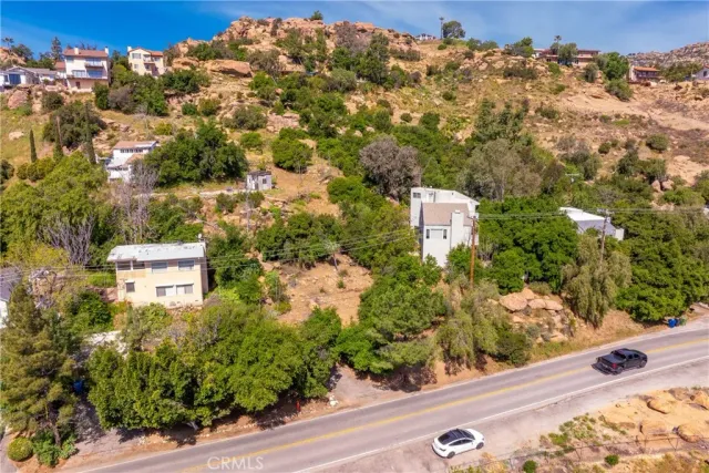 an aerial view of house with yard