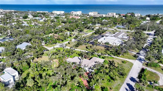 an aerial view of a residential houses with yard and outdoor space