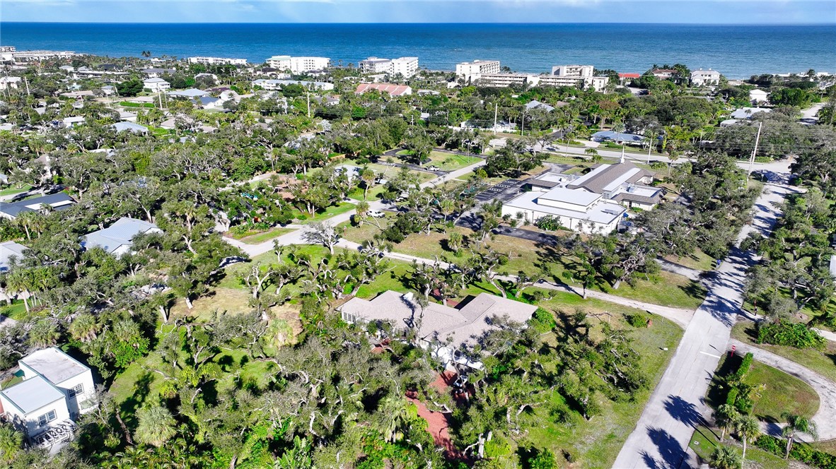an aerial view of a residential houses with yard and outdoor space