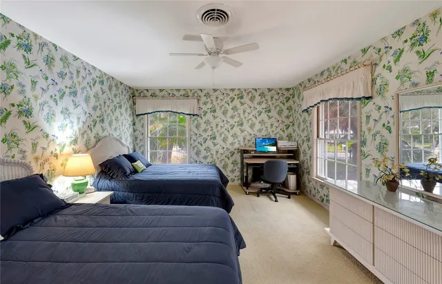 a bath room with a couch and a table