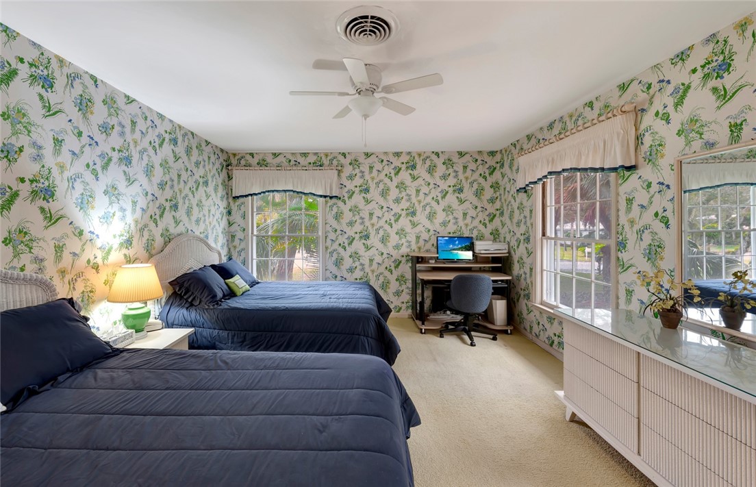 3765 Flamingo Drive Vero Beach, FL 32963 - Photo 16 of 28 a living room with furniture fireplace and a chandelier