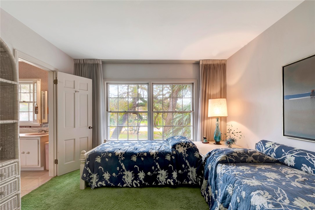 3765 Flamingo Drive Vero Beach, FL 32963 - Photo 18 of 28 a bedroom with a bed and a window