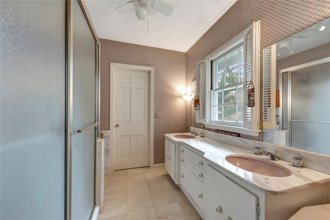 3765 Flamingo Drive Vero Beach, FL 32963 - Photo 19 of 28 a bathroom with a granite countertop sink mirror and double