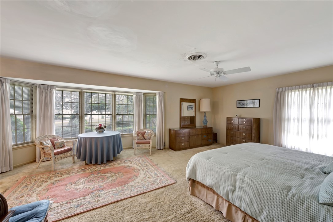 3765 Flamingo Drive Vero Beach, FL 32963 - Photo 21 of 28 a bedroom with a large bed and a large window