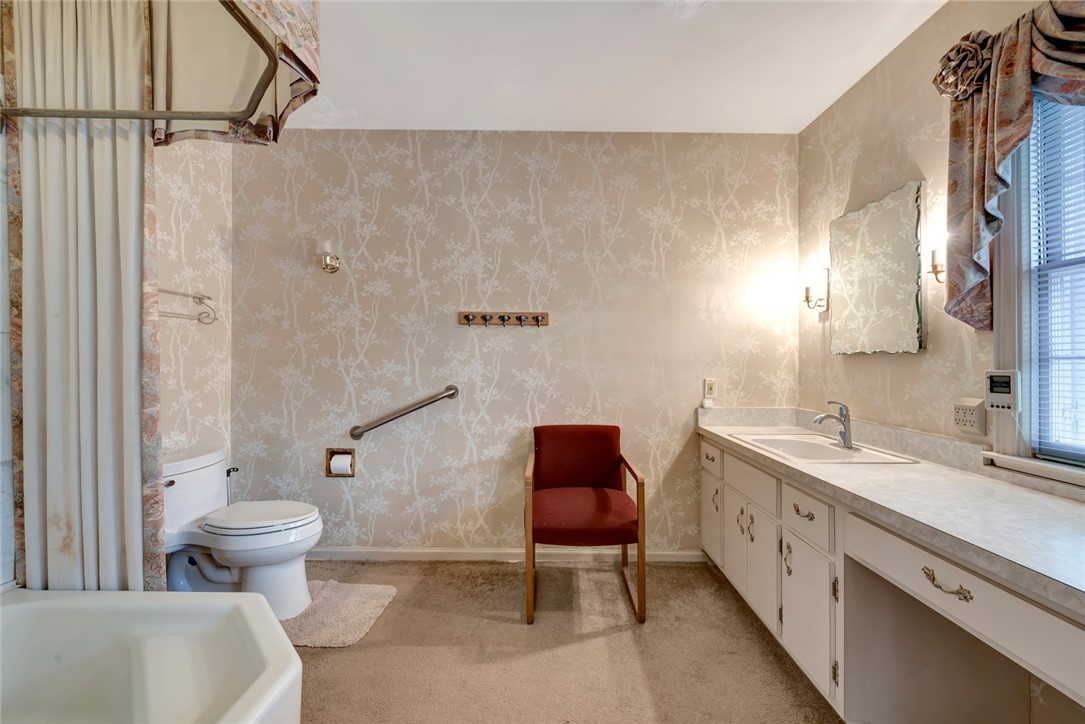 3765 Flamingo Drive Vero Beach, FL 32963 - Photo 24 of 28 a bathroom with a sink a toilet a mirror and shower