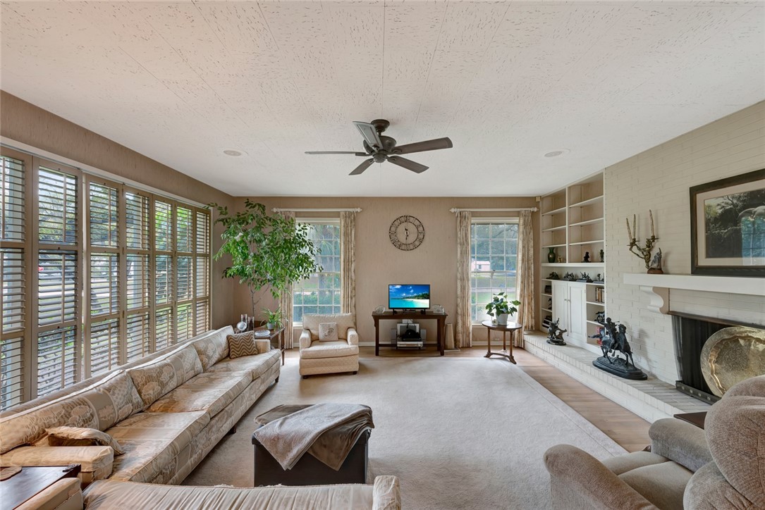 3765 Flamingo Drive Vero Beach, FL 32963 - Photo 8 of 28 a living room with furniture and a fireplace