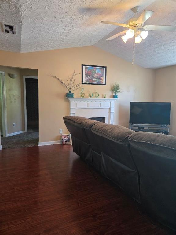 35 Pembroke Place Covington, GA 30016 - Photo 3 of 32 a living room with a couch and a potted plant