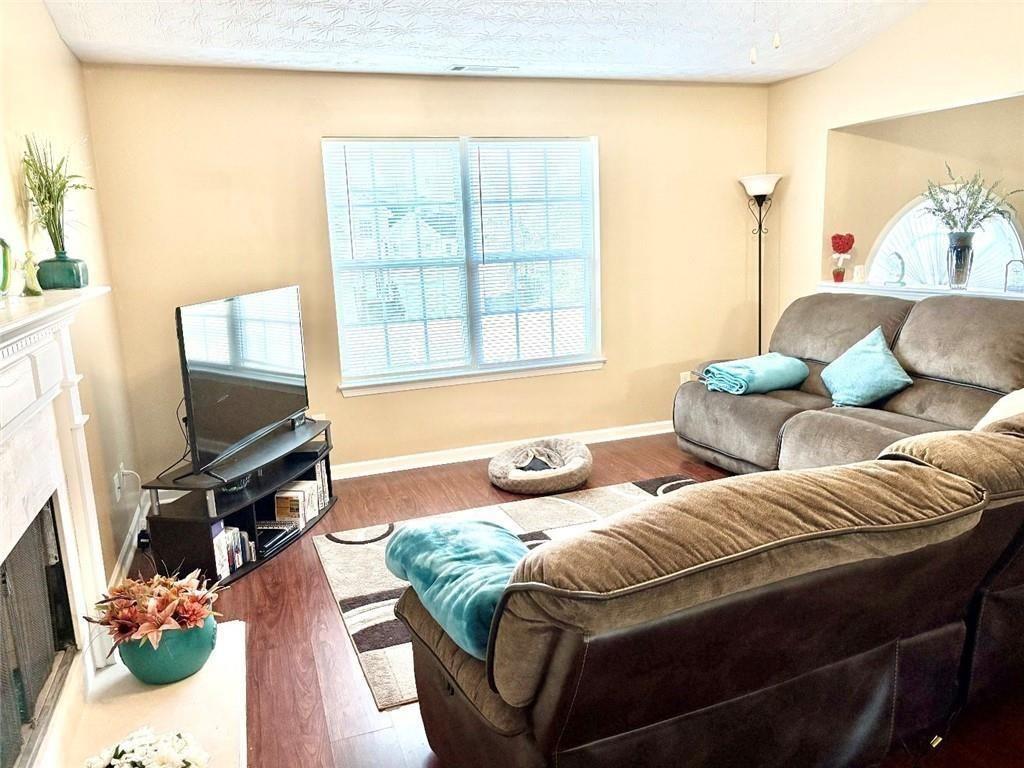 35 Pembroke Place Covington, GA 30016 - Photo 5 of 32 a bedroom with furniture and a flat screen tv