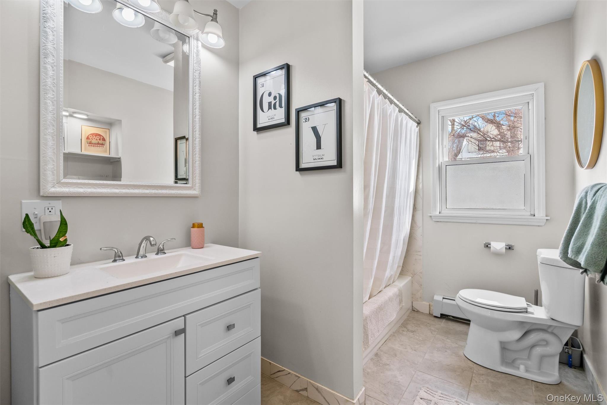 38 Post Hill Road Mountain Dale, NY 12763 - Photo 20 of 27 Full bathroom featuring vanity, baseboard heating, toilet, and shower / bathtub combination with curtain