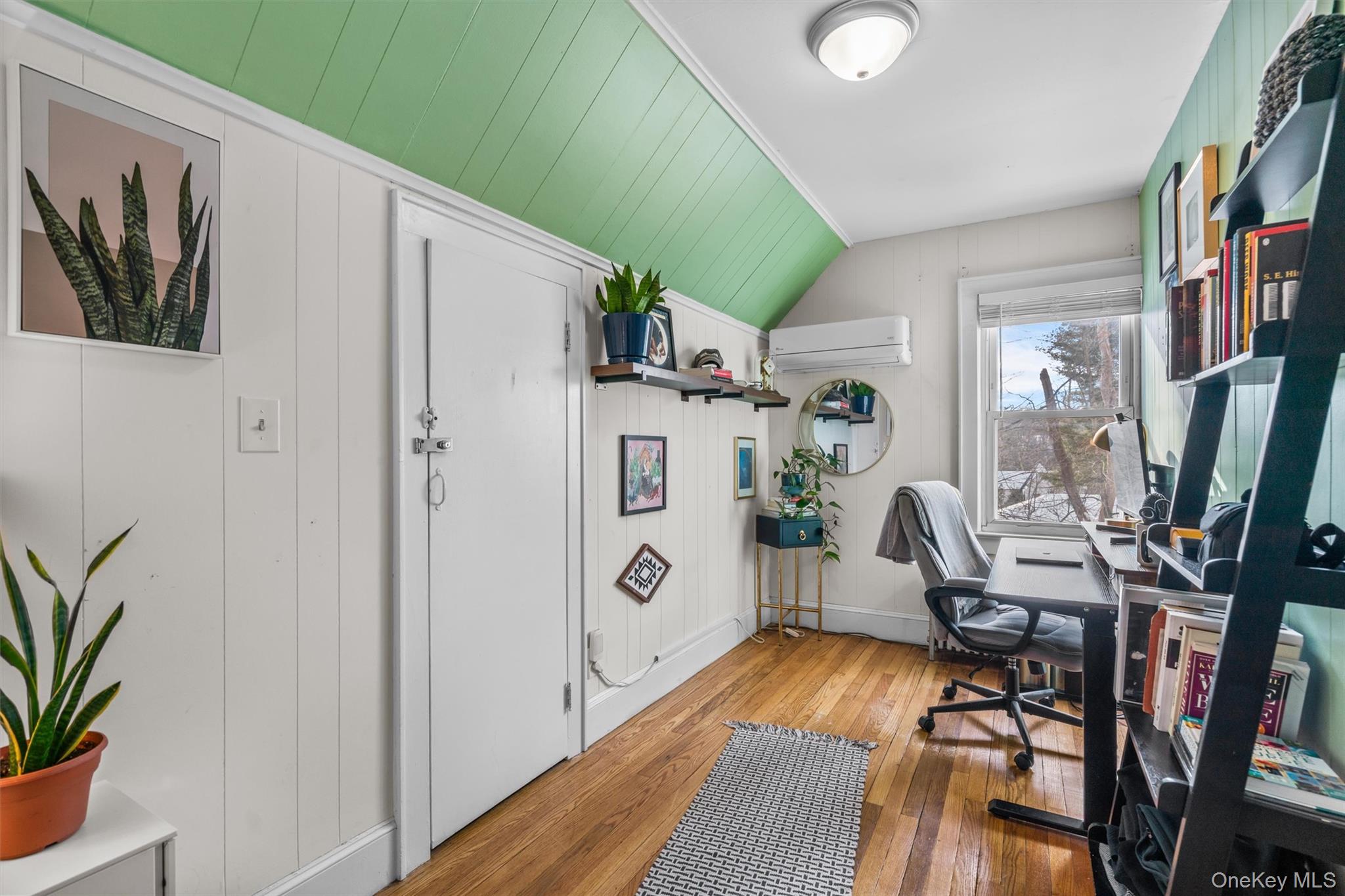 38 Post Hill Road Mountain Dale, NY 12763 - Photo 23 of 27 Office featuring vaulted ceiling, a wall mounted AC, light hardwood / wood-style floors, and wood walls