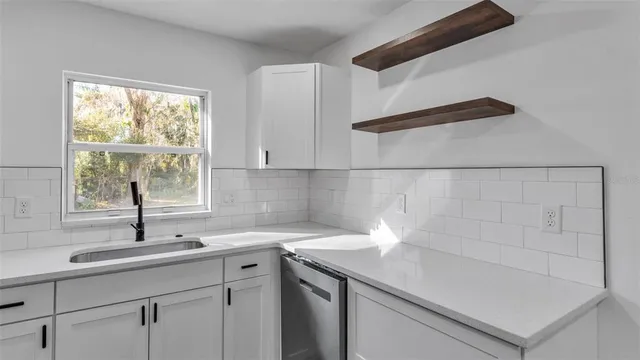 a kitchen with a sink and a window