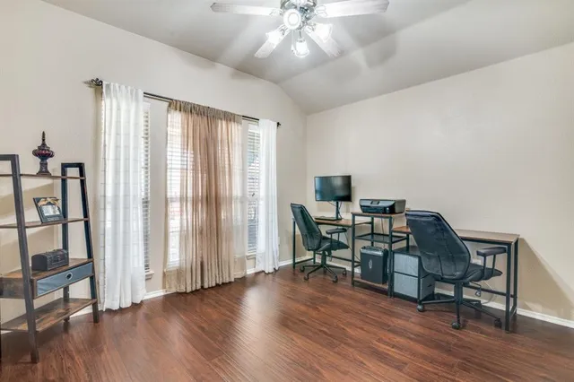 a workspace with furniture window and wooden floor