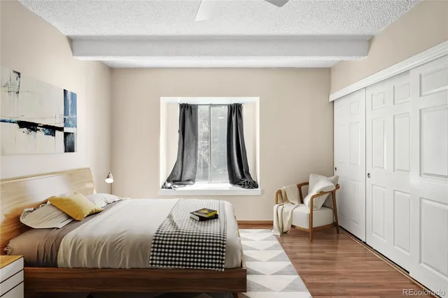 a bedroom with a bed and a mirror