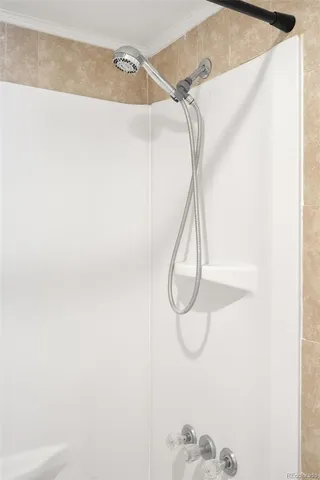 a bathroom with a glass shower door