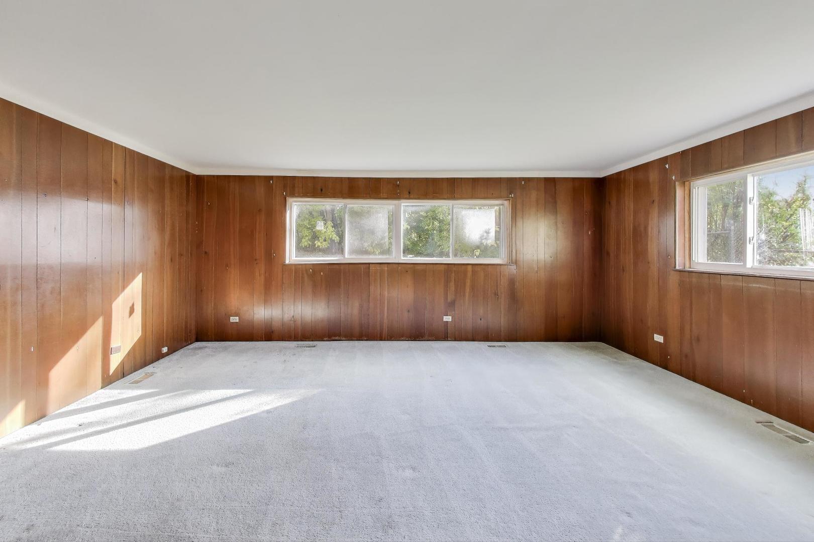 221 Heine Avenue Elgin, IL 60123 - Photo 13 of 43 an empty room with windows