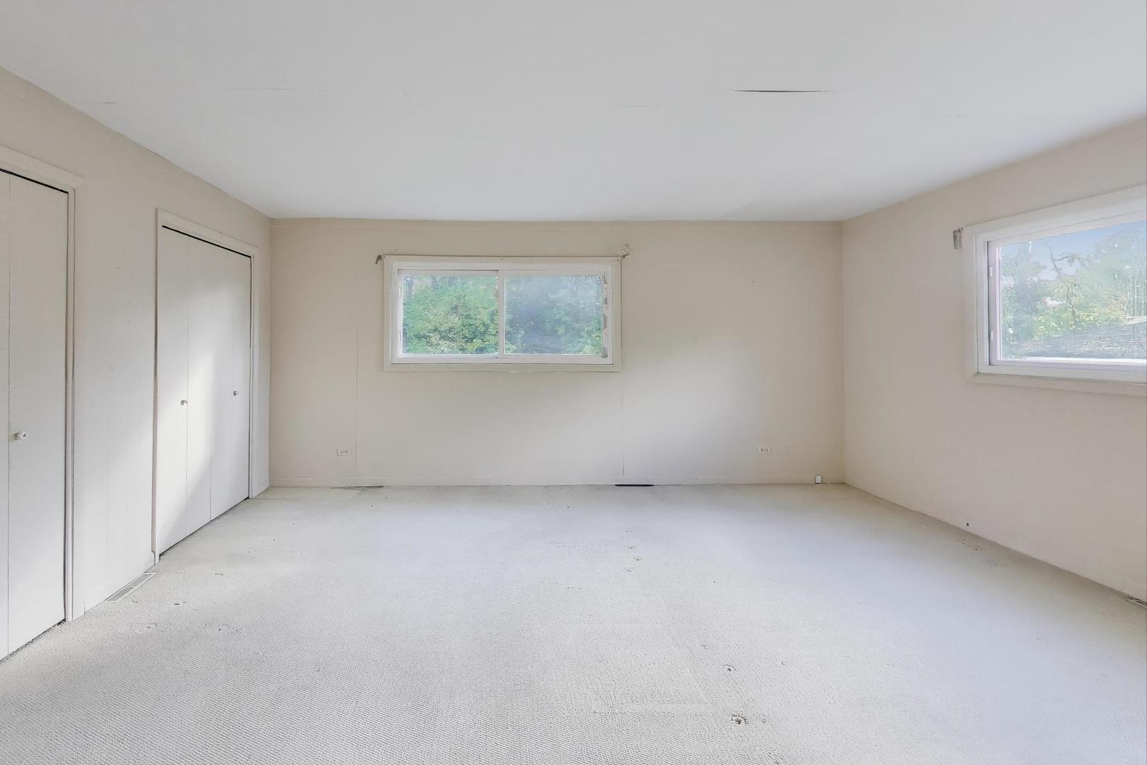 221 Heine Avenue Elgin, IL 60123 - Photo 22 of 43 an empty room with windows