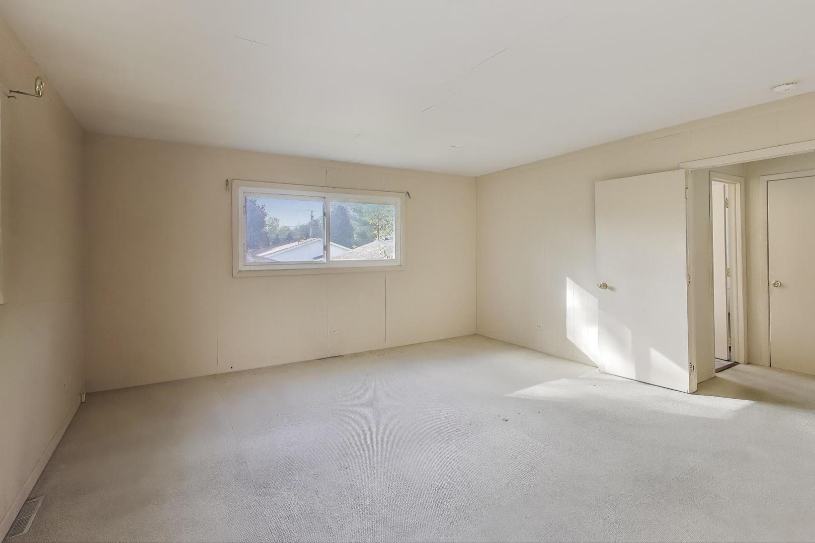 221 Heine Avenue Elgin, IL 60123 - Photo 23 of 43 an empty room with windows