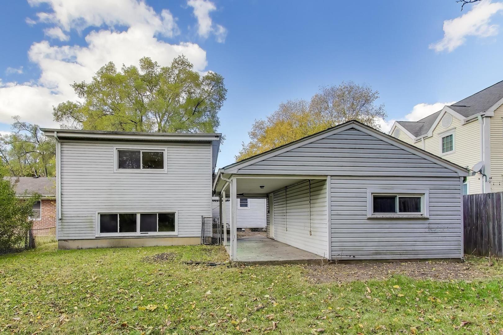 221 Heine Avenue Elgin, IL 60123 - Photo 31 of 43 a front view of a house with garden