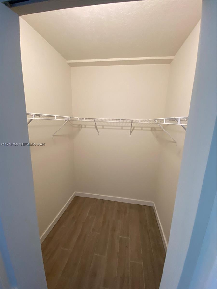 26511 Southwest 146th Court, Unit 216 Homestead, FL 33032 - Photo 6 of 6 a view of a room with racks on the wall