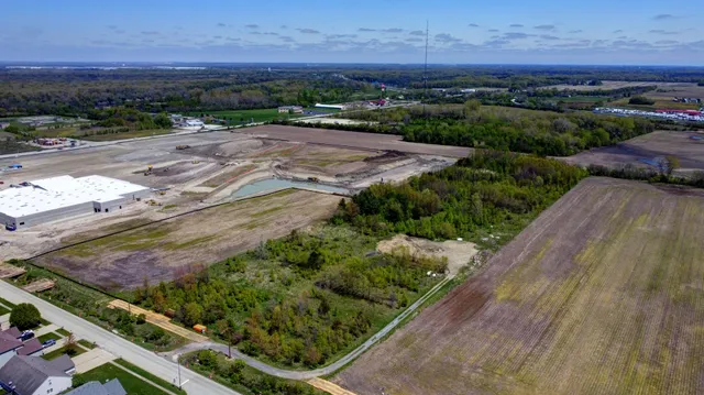 an aerial view of residential houses and outdoor space