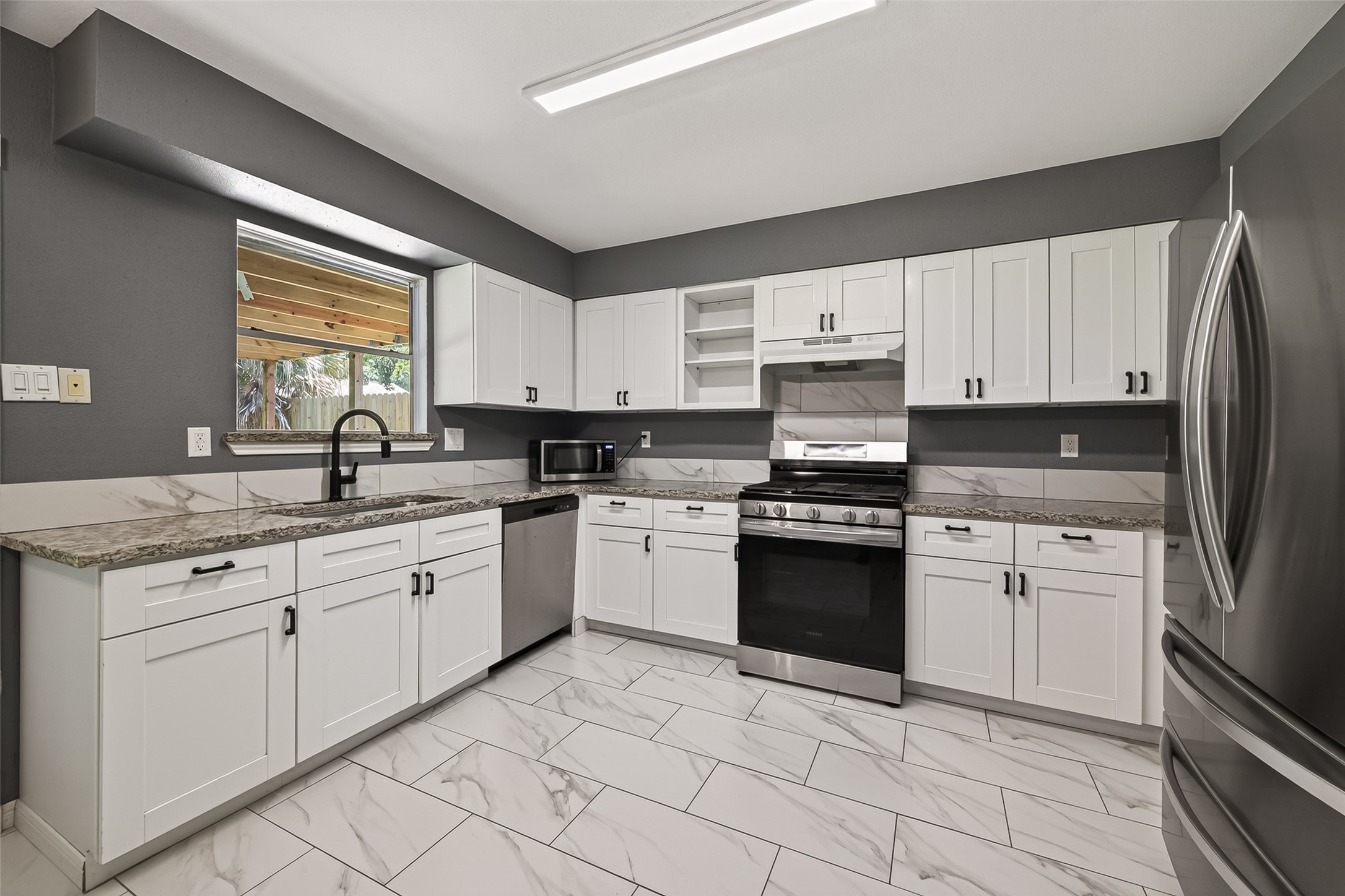 24006 Lone Elm Drive Spring, TX 77373 - Photo 7 of 25 Updated kitchen has plenty of storage space