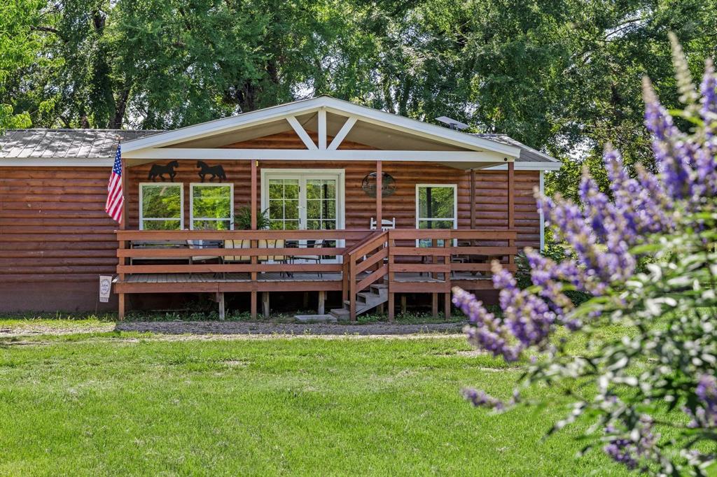 a backyard of a house with yard and outdoor seating