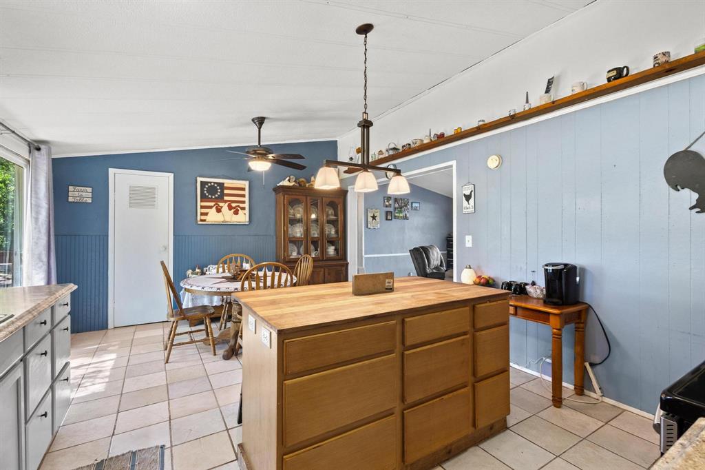 489 Delphia Drive Denison, TX 75021 - Photo 18 of 40 a view of a dining room with furniture and chandelier