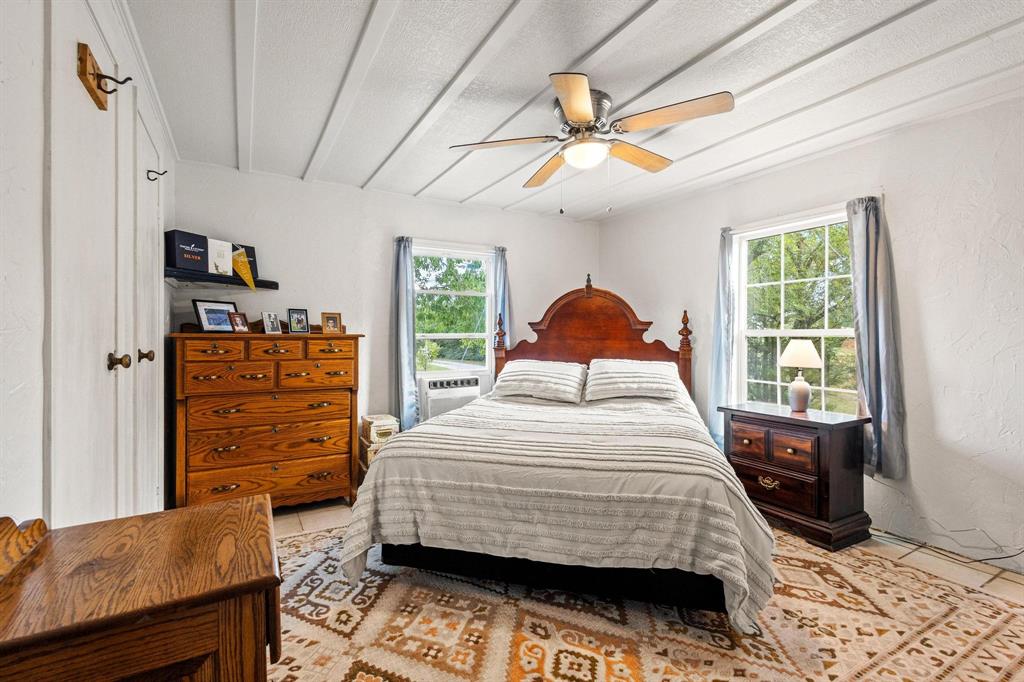489 Delphia Drive Denison, TX 75021 - Photo 20 of 40 a bedroom with a bed and a dresser
