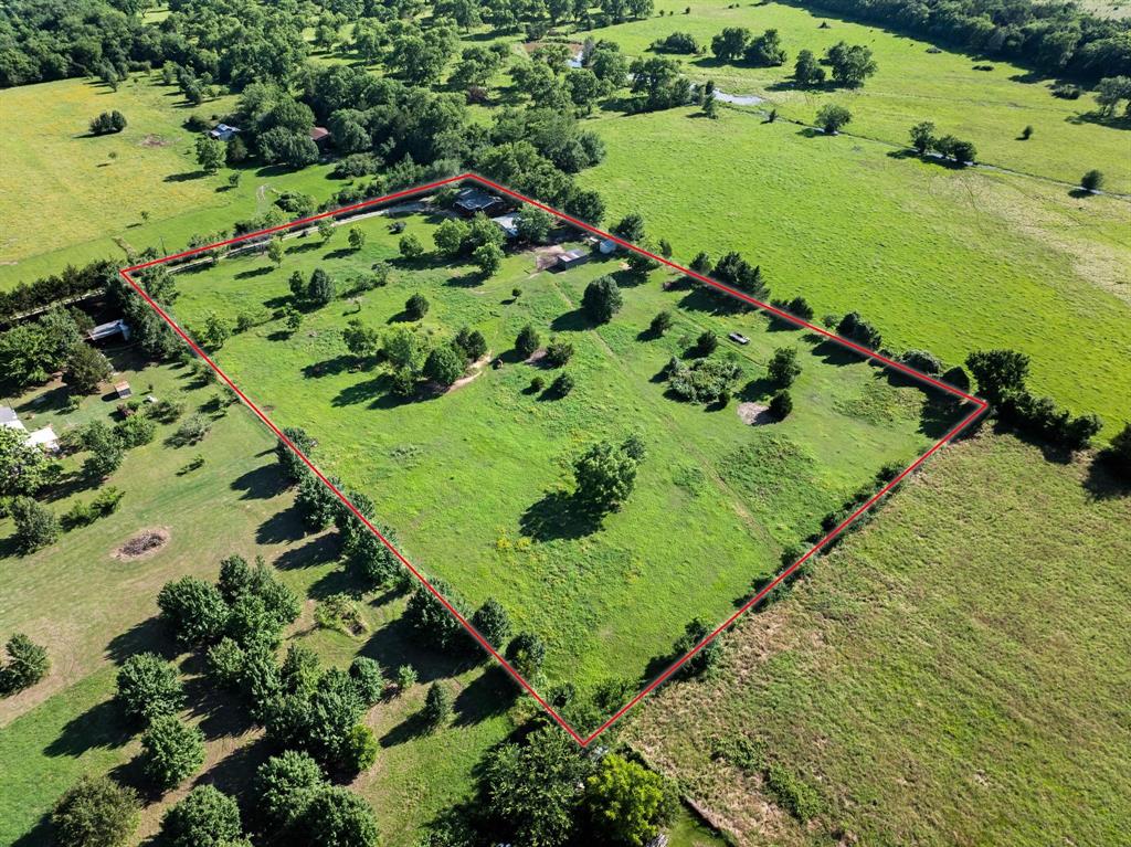 489 Delphia Drive Denison, TX 75021 - Photo 2 of 40 a view of a garden with an umbrella