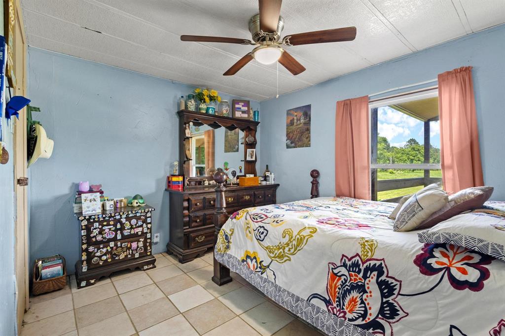 489 Delphia Drive Denison, TX 75021 - Photo 24 of 40 a bedroom with a bed and a window