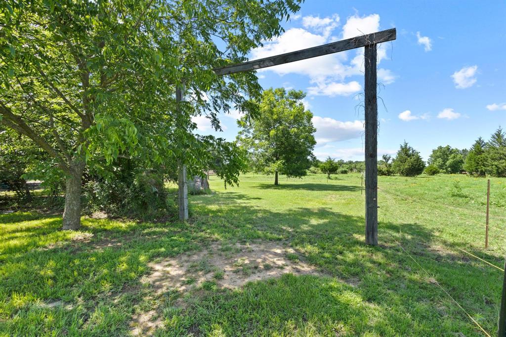 489 Delphia Drive Denison, TX 75021 - Photo 28 of 40 a view of a tree in a yard