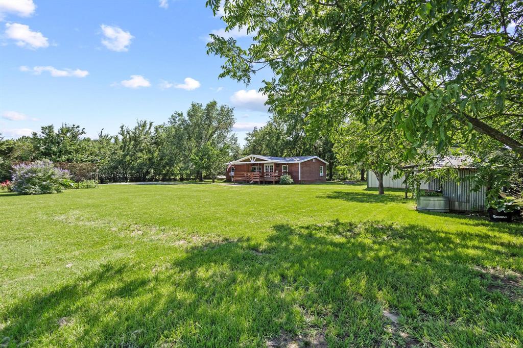 489 Delphia Drive Denison, TX 75021 - Photo 29 of 40 a view of a house with a big yard