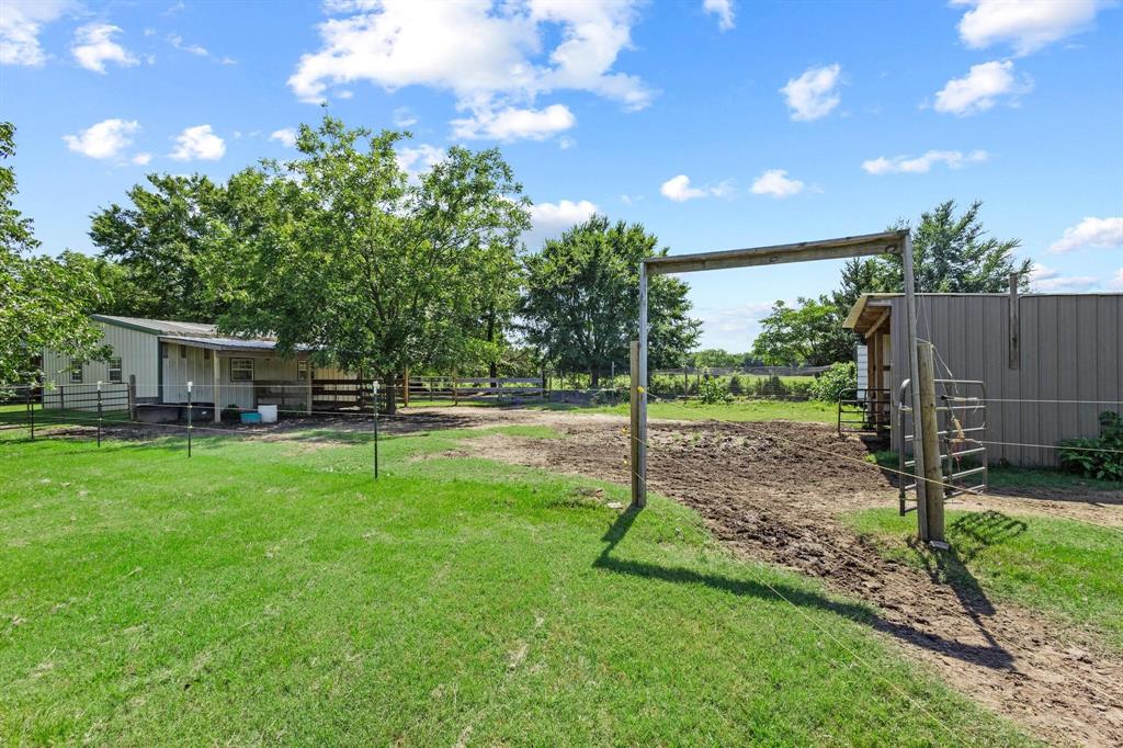 489 Delphia Drive Denison, TX 75021 - Photo 30 of 40 a view of a house with backyard and a slide