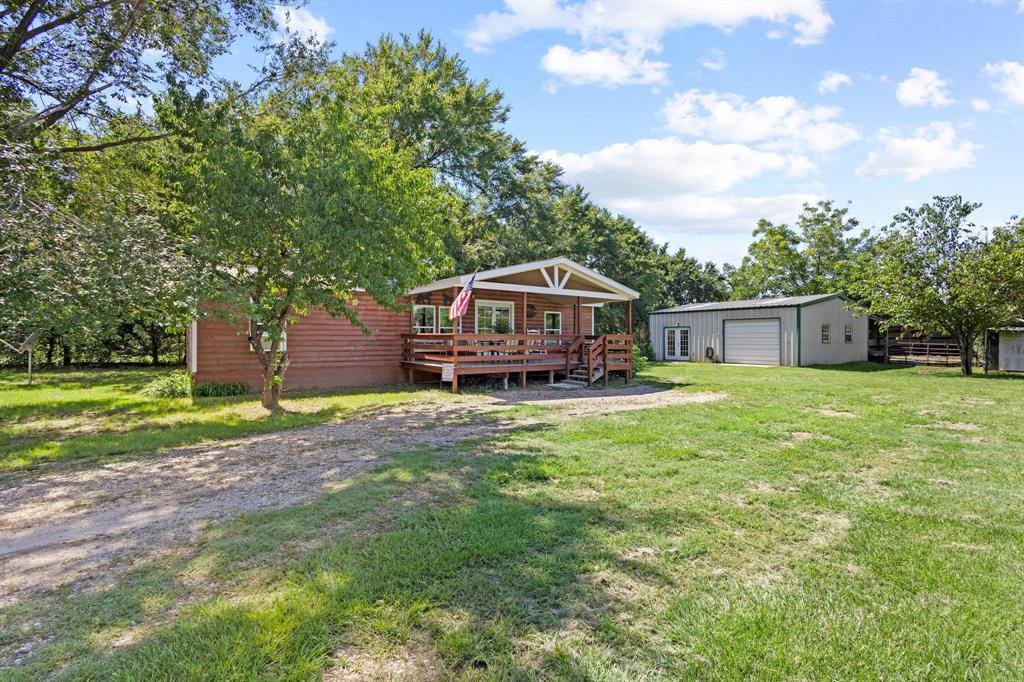 489 Delphia Drive Denison, TX 75021 - Photo 4 of 40 a house view with a garden space