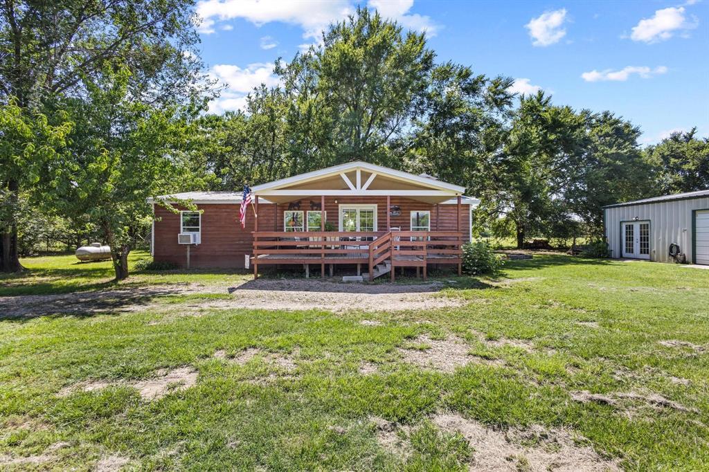 489 Delphia Drive Denison, TX 75021 - Photo 5 of 40 a view of a house with a yard