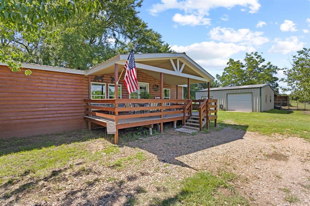 489 Delphia Drive Denison, TX 75021 - Photo 6 of 40 a view of a house with a yard and sitting area