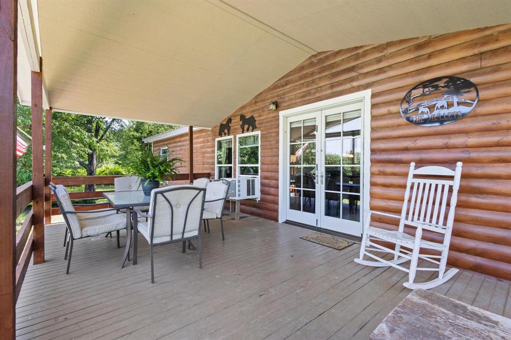 489 Delphia Drive Denison, TX 75021 - Photo 7 of 40 a view of a patio with a table and chairs